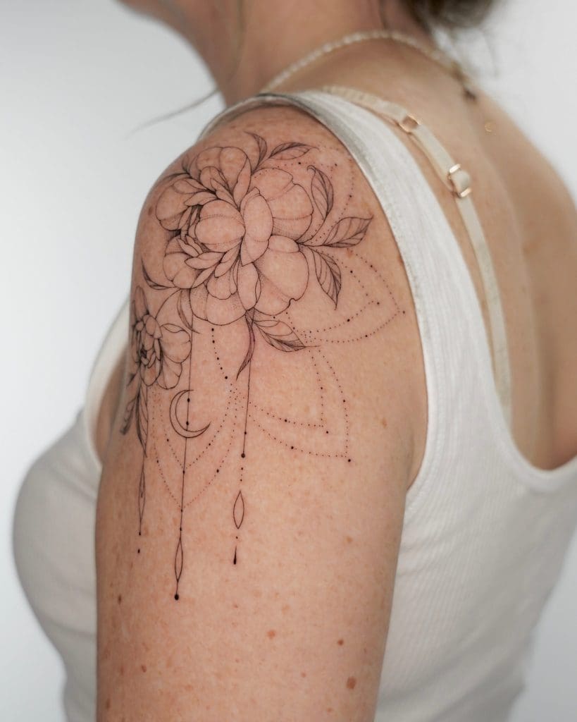 Fineline floral arm tattoo